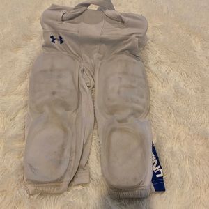 Medium under armor football pants with pads. Smoke free home.